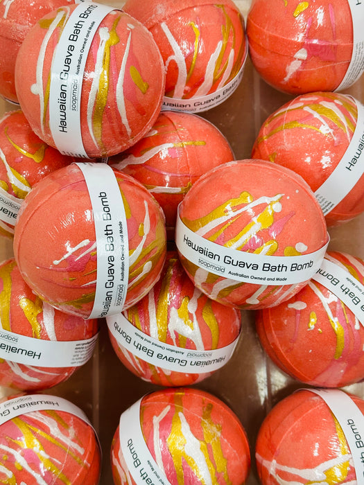 A collection of tropical Hawaiian Guava Bath Bombs with gold and pearl swirls, labelled and retail ready